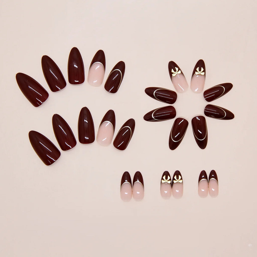 24 handmade almond nails. Burgundy base with nude French, white lines & metal bows. Reusable, elegant retro style for daily wear